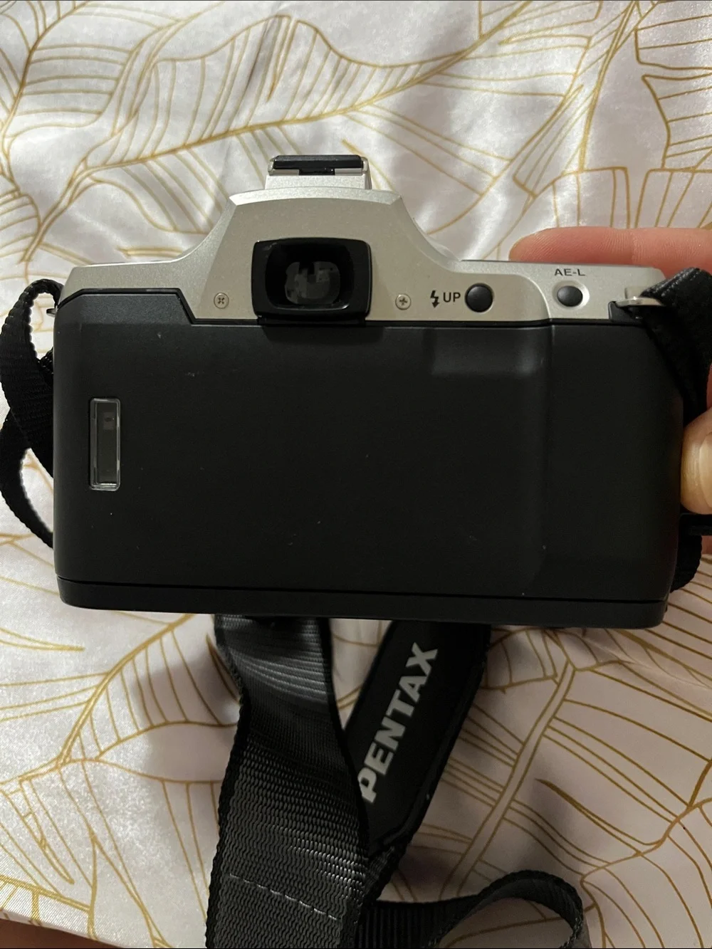 Pentax Silver and Black DSLR with 28-90mm Zoom Lens and Branded Strap